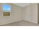 Carpeted bedroom featuring a window and neutral paint at 7533 Nighthawk Drive, Sarasota, FL 34241