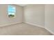 Bedroom with a carpeted floor and a single window at 7533 Nighthawk Drive, Sarasota, FL 34241