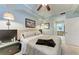 Relaxing bedroom with a cozy bed, soft lighting, and ensuite bathroom at 7803 Grand Estuary Trl # 303, Bradenton, FL 34212