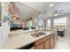 Kitchen sink and countertop area with a view of the dining area and living room at 7803 Grand Estuary Trl # 303, Bradenton, FL 34212