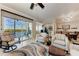 Spacious living room with a view of the screened-in patio and an open floor plan into the dining and kitchen areas at 7803 Grand Estuary Trl # 303, Bradenton, FL 34212