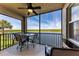 Screened in patio with waterfront view, ceiling fan and table for seating at 7803 Grand Estuary Trl # 303, Bradenton, FL 34212