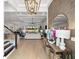 Bright living room features a coffered ceiling, modern chandelier, and an open floor plan at 8281 Redonda Loop, Lakewood Ranch, FL 34202