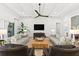 Cozy living room featuring modern furnishings, a ceiling fan, and large television at 8281 Redonda Loop, Lakewood Ranch, FL 34202