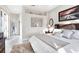 Bright main bedroom featuring a large bed, neutral decor, and serene views from a large window at 8610 51St E Ter, Bradenton, FL 34211