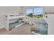 Shared bedroom featuring built-in bunk beds and a window with a scenic view of the golf course at 8847 Colonels Ct, Sarasota, FL 34240