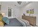 Comfortable bedroom featuring a dresser and a view to the ensuite bath at 8847 Colonels Ct, Sarasota, FL 34240