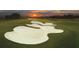 Picturesque golf course with sand traps during sunset, highlighting the manicured greens at 8847 Colonels Ct, Sarasota, FL 34240