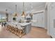 Gourmet kitchen with large island, white cabinets, and counter seating at 8847 Colonels Ct, Sarasota, FL 34240