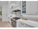 Modern kitchen showcasing stainless steel appliances, white cabinetry, and stylish tile backsplash at 8847 Colonels Ct, Sarasota, FL 34240