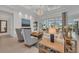 Elegant living room featuring a fireplace, stylish decor, and golf course views at 8847 Colonels Ct, Sarasota, FL 34240