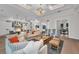 Bright open living room with view into gourmet kitchen at 8847 Colonels Ct, Sarasota, FL 34240