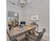 Cozy home office space features a rustic wood desk, comfortable seating, and stylish decor at 8847 Colonels Ct, Sarasota, FL 34240