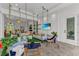 Inviting outdoor space with hanging daybeds overlooking a living area at 8847 Colonels Ct, Sarasota, FL 34240