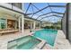 Gorgeous pool and attached spa with plenty of outdoor living area with screened enclosure at 8847 Colonels Ct, Sarasota, FL 34240