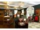 Elegant pro shop interior with displays of golf apparel and leather seating at 8847 Colonels Ct, Sarasota, FL 34240
