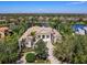 Aerial view of a beautiful home, showing the expansive property and lake views at 7921 Waterton Ln, Lakewood Ranch, FL 34202