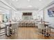 Stylish bar area featuring ample seating, sleek countertops, and a wide selection of beverages at 7921 Waterton Ln, Lakewood Ranch, FL 34202