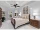 Bright bedroom featuring a ceiling fan, neutral colors and plush carpet throughout at 7921 Waterton Ln, Lakewood Ranch, FL 34202