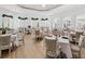 Elegant dining area with tables set for service, offering a refined atmosphere for meals at 7921 Waterton Ln, Lakewood Ranch, FL 34202