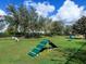 Dog park featuring agility equipment and open space, creating a welcoming environment for pets at 7921 Waterton Ln, Lakewood Ranch, FL 34202