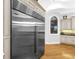 Modern kitchen featuring a large refrigerator and custom cabinets at 7921 Waterton Ln, Lakewood Ranch, FL 34202