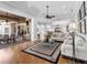 Inviting living space with hardwood floors, open floor plan, and access to an outdoor lounge at 7921 Waterton Ln, Lakewood Ranch, FL 34202