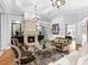 Bright living room featuring a stone fireplace, hardwood floors, elegant seating, and sophisticated decor at 7921 Waterton Ln, Lakewood Ranch, FL 34202