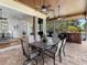 Covered patio with open access to the indoor living space and offering a scenic view of the lake at 7921 Waterton Ln, Lakewood Ranch, FL 34202