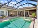Large screened pool and spa surrounded by the house for the ultimate outdoor experience at 7921 Waterton Ln, Lakewood Ranch, FL 34202