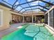 A private enclosed pool and spa surrounded by the house featuring many access points at 7921 Waterton Ln, Lakewood Ranch, FL 34202