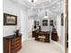 Elegant vanity room features dark wood furniture, decorative lighting, and full mirror coverage at 7921 Waterton Ln, Lakewood Ranch, FL 34202