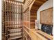 Custom wine cellar with wooden racking and space for a large wine collection at 7921 Waterton Ln, Lakewood Ranch, FL 34202