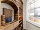 Elegant wine cellar with custom-built wooden racks and decor at 7921 Waterton Ln, Lakewood Ranch, FL 34202