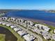 Waterfront condo community featuring multiple buildings, covered parking, and lush landscaping at 1020 Tidewater Shores Loop # 107, Bradenton, FL 34208