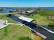Aerial view of a boat lift, showcasing waterfront living with easy canal access at 1020 Tidewater Shores Loop # 107, Bradenton, FL 34208