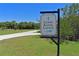 Directional sign for the Canoe/Kayak launch with pristine landscaping at 1020 Tidewater Shores Loop # 107, Bradenton, FL 34208