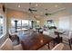 Bright and inviting dining area overlooking the marina, featuring multiple tables and comfortable seating at 1020 Tidewater Shores Loop # 107, Bradenton, FL 34208