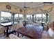 Charming dining area with waterfront views, nautical decor, and plenty of natural light at 1020 Tidewater Shores Loop # 107, Bradenton, FL 34208