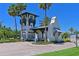 Community entrance gatehouse with white exterior, dark green trim, and lush landscaping at 1020 Tidewater Shores Loop # 107, Bradenton, FL 34208