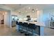 Bright, open kitchen with stainless steel appliances, white cabinetry, and a large island with bar seating at 1020 Tidewater Shores Loop # 107, Bradenton, FL 34208