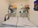 Organized laundry room featuring a side-by-side washer and dryer and ample shelving at 1020 Tidewater Shores Loop # 107, Bradenton, FL 34208