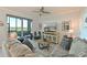 Cozy living room with water views, comfortable seating, and a large sliding glass door at 1020 Tidewater Shores Loop # 107, Bradenton, FL 34208