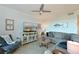 Comfortable living room featuring a ceiling fan, neutral colors, and stylish decor at 1020 Tidewater Shores Loop # 107, Bradenton, FL 34208