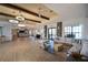 Expansive lounge area featuring modern light fixtures, comfortable seating, and elegant interior design at 1020 Tidewater Shores Loop # 107, Bradenton, FL 34208