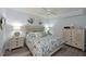 Serene main bedroom with coastal decor, wood floors, and ample natural light at 1020 Tidewater Shores Loop # 107, Bradenton, FL 34208