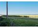 Water view showcases lush greenery and serene lake expanse, offering a tranquil setting at 1020 Tidewater Shores Loop # 107, Bradenton, FL 34208