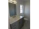 Modern bathroom with sleek vanity, stylish fixtures, updated lighting, and pristine white walls, offering a spa-like experience at 1027 Newton St, Englewood, FL 34224