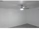 Bright bedroom featuring neutral walls, ceiling fan, and durable floors at 1027 Newton St, Englewood, FL 34224