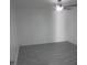 A cozy bedroom featuring neutral walls, ceiling fan, and durable floors at 1027 Newton St, Englewood, FL 34224